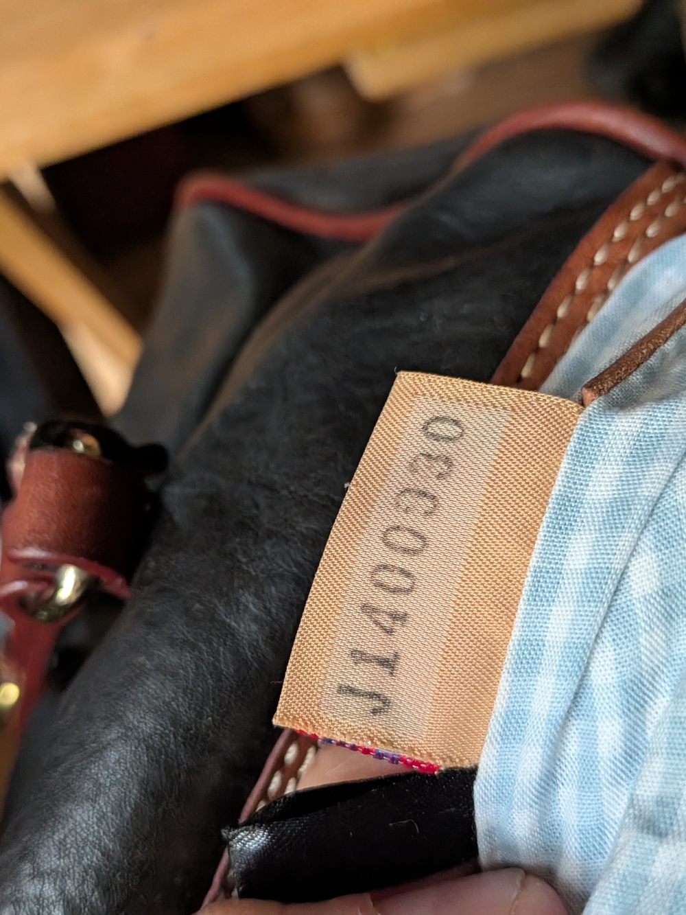 Dooney & Bourke Black Leather Barrel Bag with Brown Trim and Gold Hardware - Picture 6 of 7